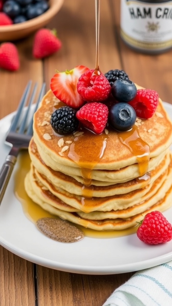 Fluffy oatmeal pancakes stacked with berries and syrup on a rustic table.